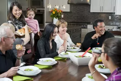 Family dinner in the kitchen of a Gatlinburg cabin