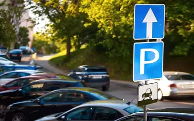 A row of cars parked on a street