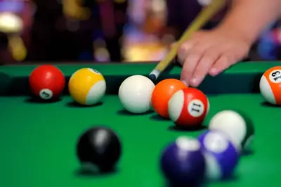 Playing_billiards_in_a_Gatlinburg_cabin_with_a_game_room
