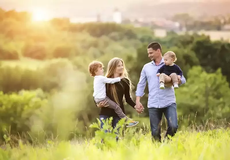 Happy family enjoying a walk in the evening