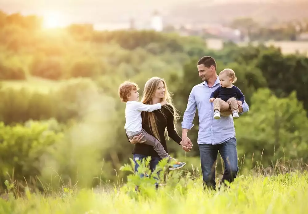 Happy family enjoying a walk in the evening