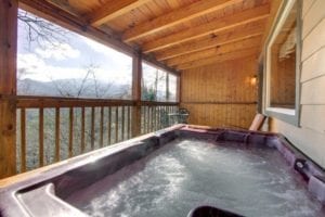 Bubbling hot tub on the deck of a Gatlinburg Tn cabin