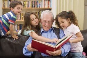 Grandfather_reading_a_story_to_grandchildren