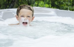 Little_boy_with_bubbles_on_face_at_his_Gatlinburg_cabin_with_a_hot_tub