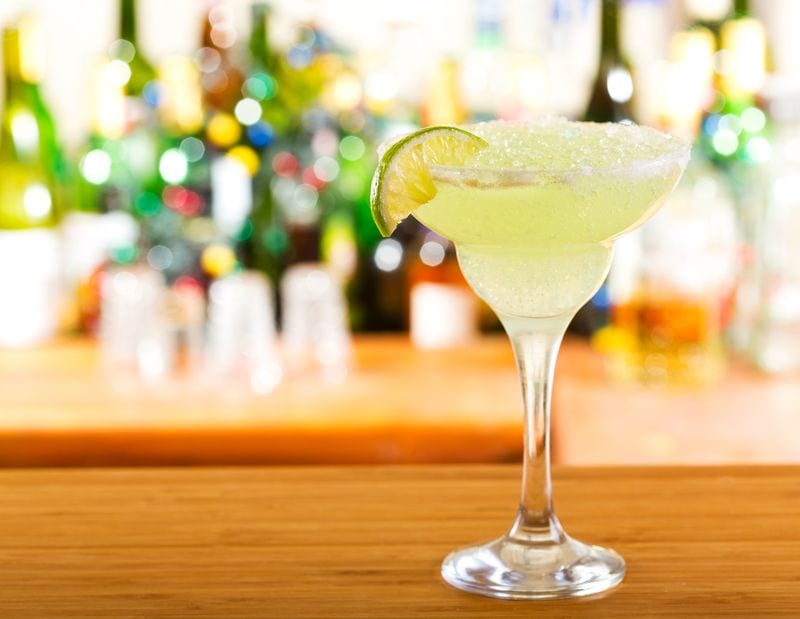 Margarita with lime on a bar