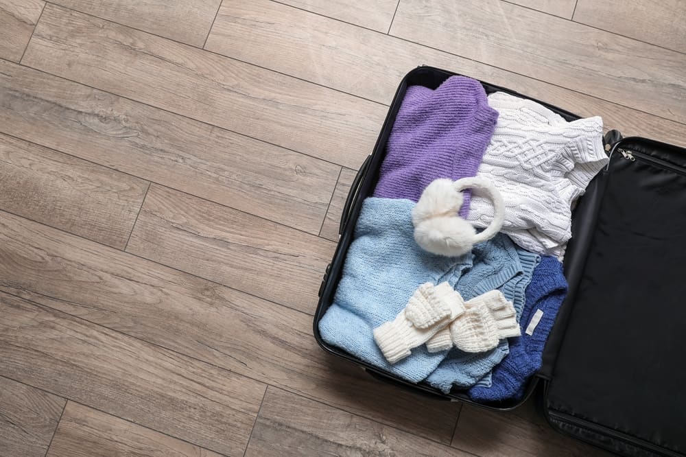 winter clothes in suitcase