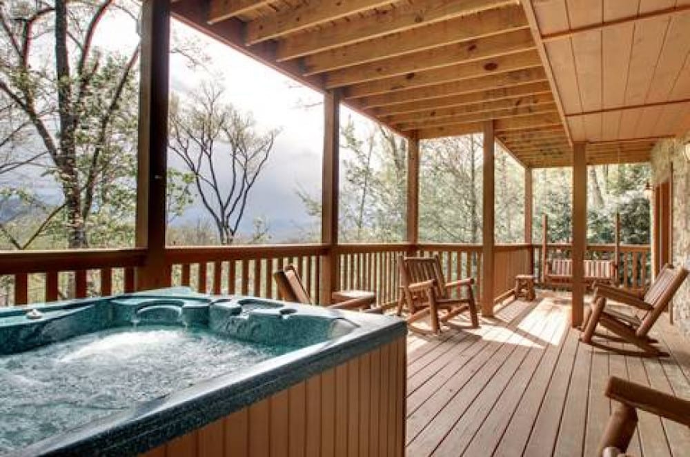 hot tub on deck of family friendly cabin in Gatlinburg TN