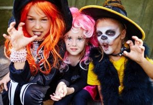 Girls dressed as witches for Halloween.
