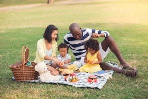 A family picnic on the grass.