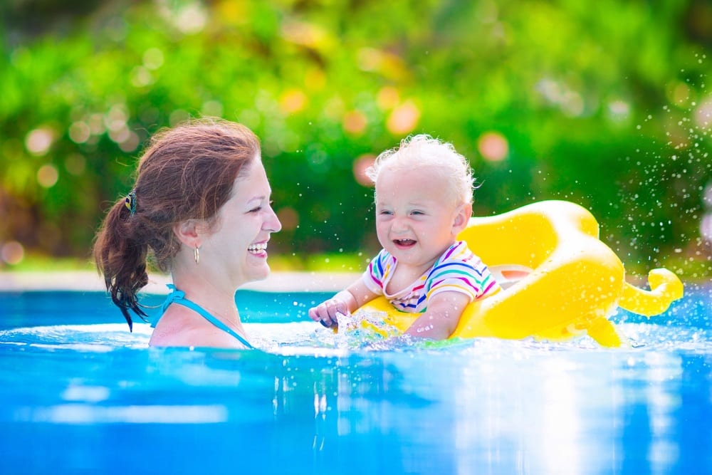 Mom and toddler in a swimming pool.